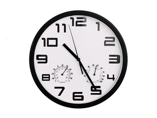 simple classic black and white round wall clock isolated on white. Clock with arabic numerals on wall shows 10:25 , 22:25