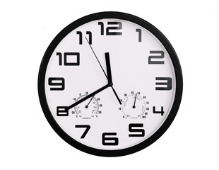 simple classic black and white round wall clock isolated on white. Clock with arabic numerals on wall shows 11:40 , 23:40