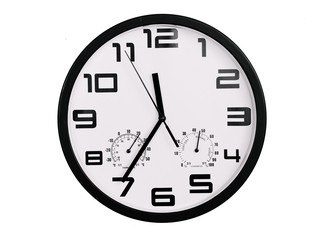 simple classic black and white round wall clock isolated on white. Clock with arabic numerals on wall shows 11:35 , 23:35