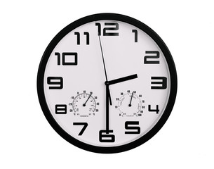 simple classic black and white round wall clock isolated on white. Clock with arabic numerals on wall shows 2:30 , 14:30