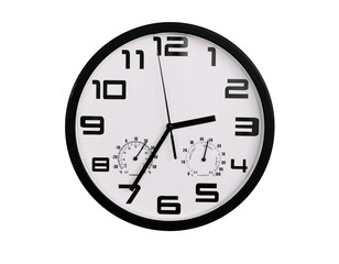 simple classic black and white round wall clock isolated on white. Clock with arabic numerals on wall shows 2:25 , 14:25