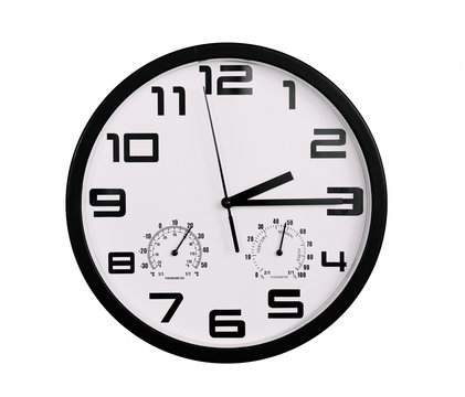 simple classic black and white round wall clock isolated on white. Clock with arabic numerals on wall shows 2:15 , 14:15