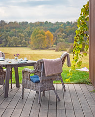 Nice terrace with chairs in countryside - obrazy, fototapety, plakaty