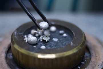 Closeup of a drop of silver for the manufacture of handmade jewelry