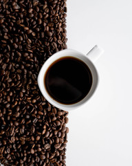 Coffee Cup on White Background with Coffee Beans
