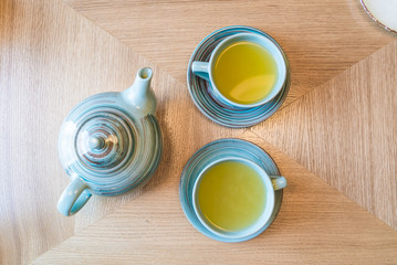 fruit tea in a beautiful blue tea set for two persons top view