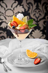 Dessert withl tropical fruits on a retro background on a retro background