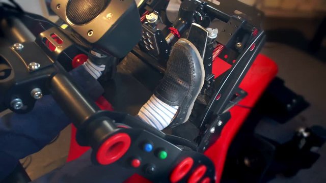 Woman Foot Presses Gas Pedal In Racing Simulator Closeup