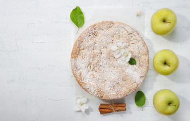 Sweet apple cake  on the gray background.