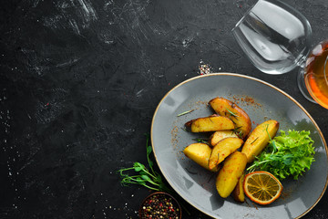 Baked potatoes in a plate. Rustic style. Top view. Free space for your text.