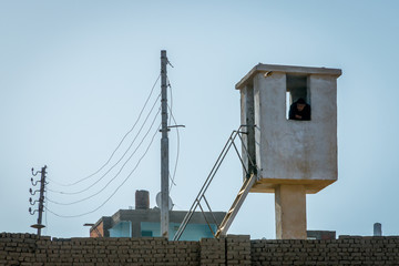 Man inside a sentry box in the Temple of Edfu..Egypt April 2019