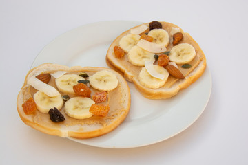Peanut butter sandwich breakfast or snack on white background.