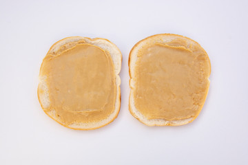 Peanut butter sandwich breakfast or snack on white background.