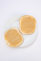 Fototapeta na wymiar Peanut butter sandwich breakfast or snack on white background.