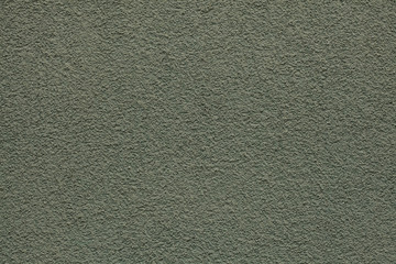 Dirty green painted stucco wall. Background texture