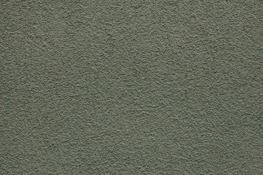 Dirty green painted stucco wall. Background texture