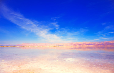 Fototapeta na wymiar Beautiful view of salty Dead Sea shore with clear water. Ein Bokek, Israel.