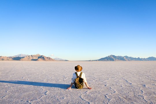 man sitting in front of desert