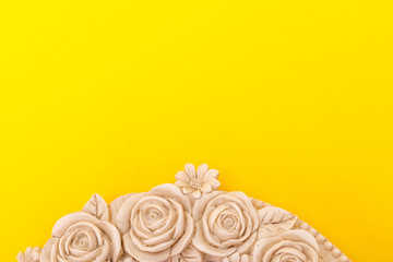 Rose texture frame on yellow background with copy space for text.