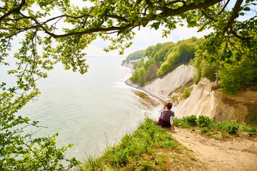 Obraz na płótnie Canvas tourists looking out to sea in Jasmund National Park 