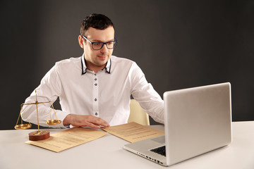 Man working on his laptop. Lawyer concept