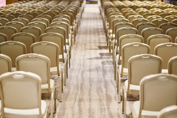 Rows of chairs in a conference room
