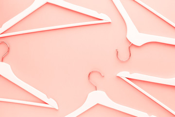 Wooden hangers toned living coral color