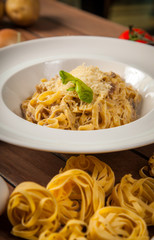 macaroni with cheese and herbal garniture