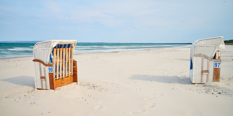 Wooden beach chairs, white sand beach, Rugen Island, Germany                               