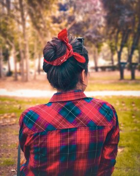 woman tied hair by red scarf