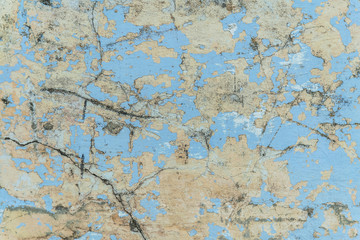 Obraz na płótnie Canvas background of a shabby old wall painted in yellow and blue