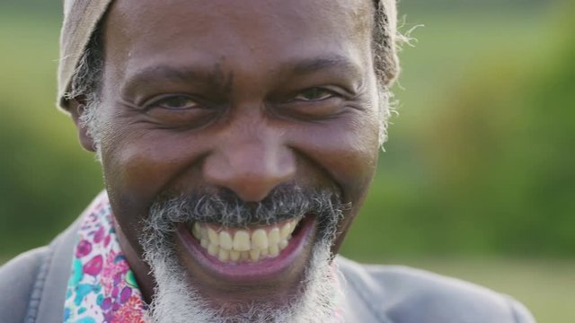 Cheerful Older Black Male Talks Happily To Camera With A Big Smile On His Face