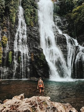 woman wearing bikini about to swim