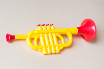 Children trumpet made of colored plastic