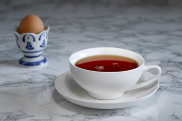 A cup of tea and a boiled egg