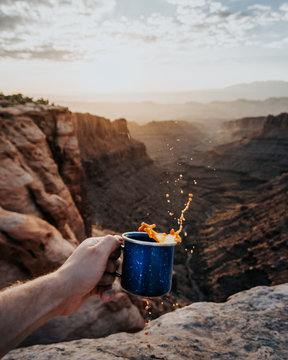 person holding spilled coffee