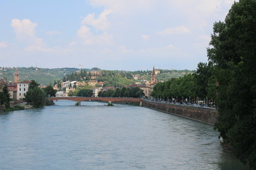 Verona old town in Italy with historical architecture and the river on a clear summer day