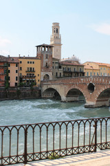 Obraz premium Verona old town in Italy with historical architecture and the river on a clear summer day
