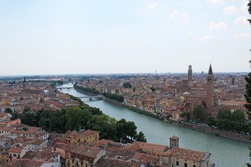 Fototapeta premium Panorama of Verona Italy with a view of the red roofs of the old town and the tower