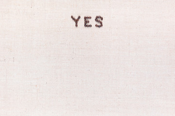 The word Yes written with coffee beans ,aligned at the top.