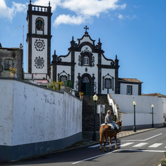 Church tower with bells and clock on Sao Miguel Island in Azores, Portugal.