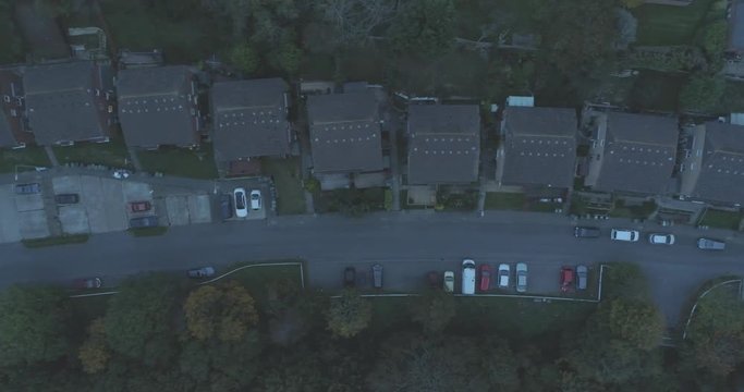 Night aerial over suburban English houses, gardens and street