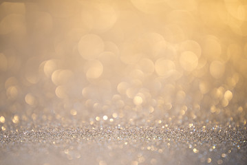 Silver glitter christmas abstract background. Defocused sequin light.