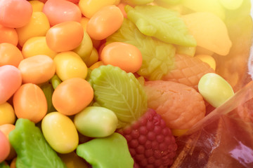 Multicolored lollipop, chewy candy. Copy space