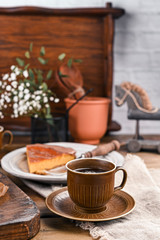 Cheesecake with chocolate and carrot puree. Vintage photo on wooden background.
