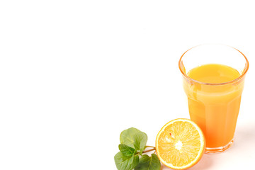 Orange and glass of orange juice on white background