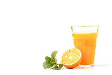 Orange and glass of orange juice on white background