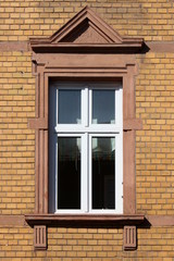 Historistic window in a yellow brick facade in Wittlich, Germany