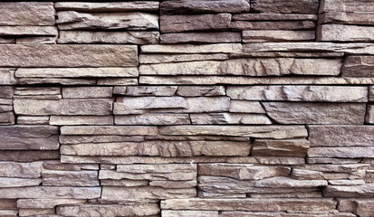 Stacked stone wall background. Photo image