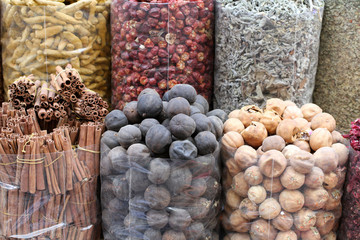 Fototapeta na wymiar Dried spices in transparent packages standing on the counter in the street market in Dubai